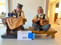 Both figurines side by side showing overall appearance and relative size