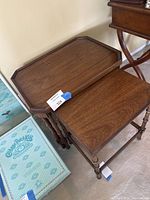 Pair of nesting tables showing size difference and tops