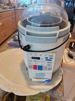 Turbo Baker V bread maker showing control panel, lid and inner pan