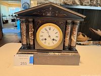 Front view showing dial, columns and overall design