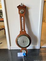 Full view of banjo barometer showing all three instruments and wood case