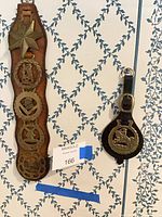 Full view of leather strap with five brasses and separate buckle strap medallion