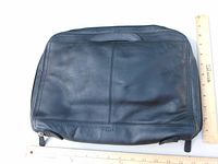 Front view of black leather briefcase showing overall condition and size reference with rulers