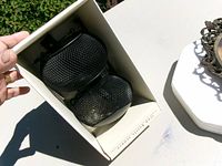 Two black metal mesh hanging votive holders inside original box