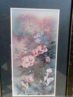Close-up of artwork showing floral imagery and colors