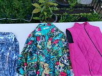 Three women’s outerwear pieces laid side by side