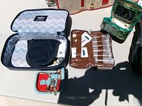 Open cosmetic, pill and manicure cases