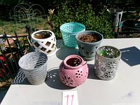 All six orchid planter pots on table
