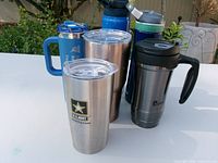 Front view of all six stainless drinkware items