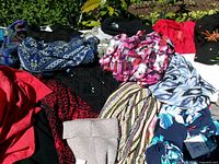 overview of mixed garments laid out, various colors and patterns visible
