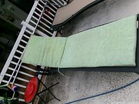 Cushion positioned on lounge chair showing fit and color