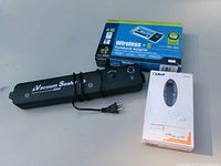 All three items: vacuum sealer, Linksys adapter box, Bluetooth headset box