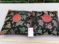 Both pillows front view with measuring stick for scale