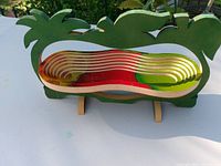 Front view of wooden collapsible bowl folded flat