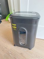 Full shredder on floor showing body, window, casters