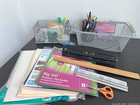 All items on desk including baskets, office supplies and organizers