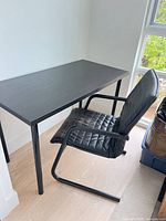Desk and chair together against wall