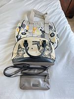 all three handbags stacked for overall view