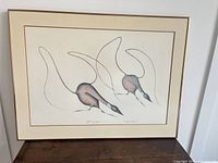 Full view of framed serigraph showing artwork, mat and frame