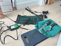Overview of heat mat, thermostat, LED light, kneeling pad, and hand tools