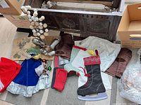 Overview of lot showing reindeer, linens, tree skirt, stocking, bag of ornaments