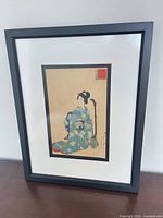 Full framed woodblock print showing subject, matting and frame
