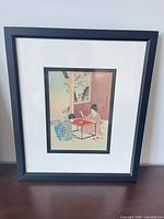 Full view of framed woodblock print with mat and frame