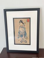 Full view of framed print showing subject and frame