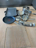 All cookware and bakeware laid out on counter
