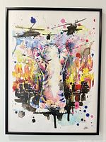 Front view of framed multicolor cat print with helicopters