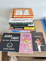 Full lot showing stacked and front-row books