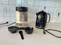 Bunn brewer, two brew trays, scoop, Oster kettle with cord