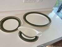 All four Vanborough serveware pieces displayed