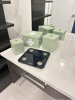 overview showing four tins and Renpho scale