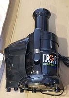 Full view of Magic Bullet Juice Bullet juicer showing feed chute and pulp container