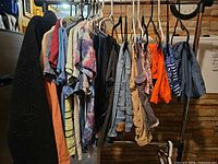 Rack of assorted men's garments on hangers