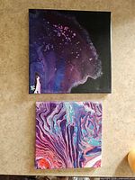 Both paintings laid out for overall view
