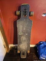 Top view of longboard showing grip tape and logo