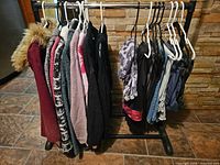 All garments hanging on rack