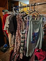 Rack showing multiple tops on hangers