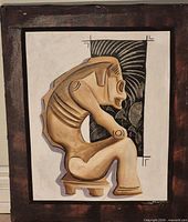 Full view of framed mixed-media relief artwork