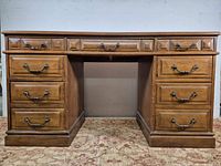 Full front view showing desk structure and all drawers