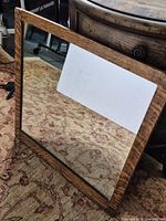 Front view of square tiger oak framed mirror