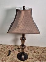 Full view of lamp showing base, shade, cord