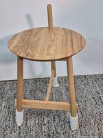 Assembled round wood side table front view