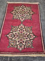 Full view of the Persian rug showing design and size