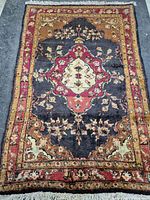 Full view of Persian rug showing overall design and colors