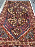 Full view of the Persian Bakhtiar rug showing overall design and borders