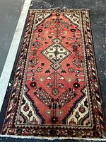 Full view of handmade Persian rug showing design and size