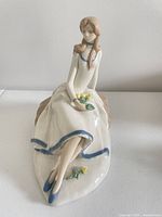 Front view of Teresa The Tulip Maiden figurine showing posture, tulips and dress coloring